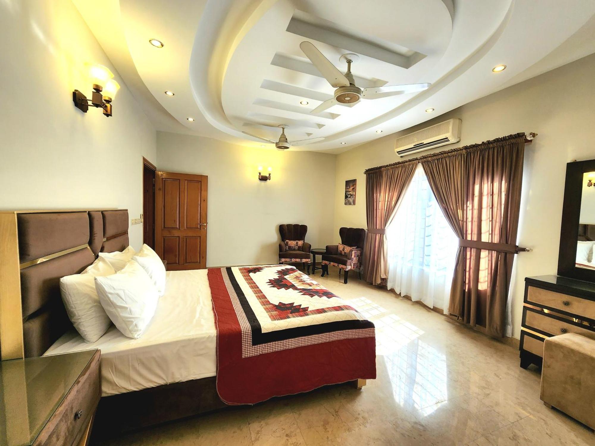 The Millenial Apartments & Suites Bahria Town Rawalpindi Oda fotoğraf