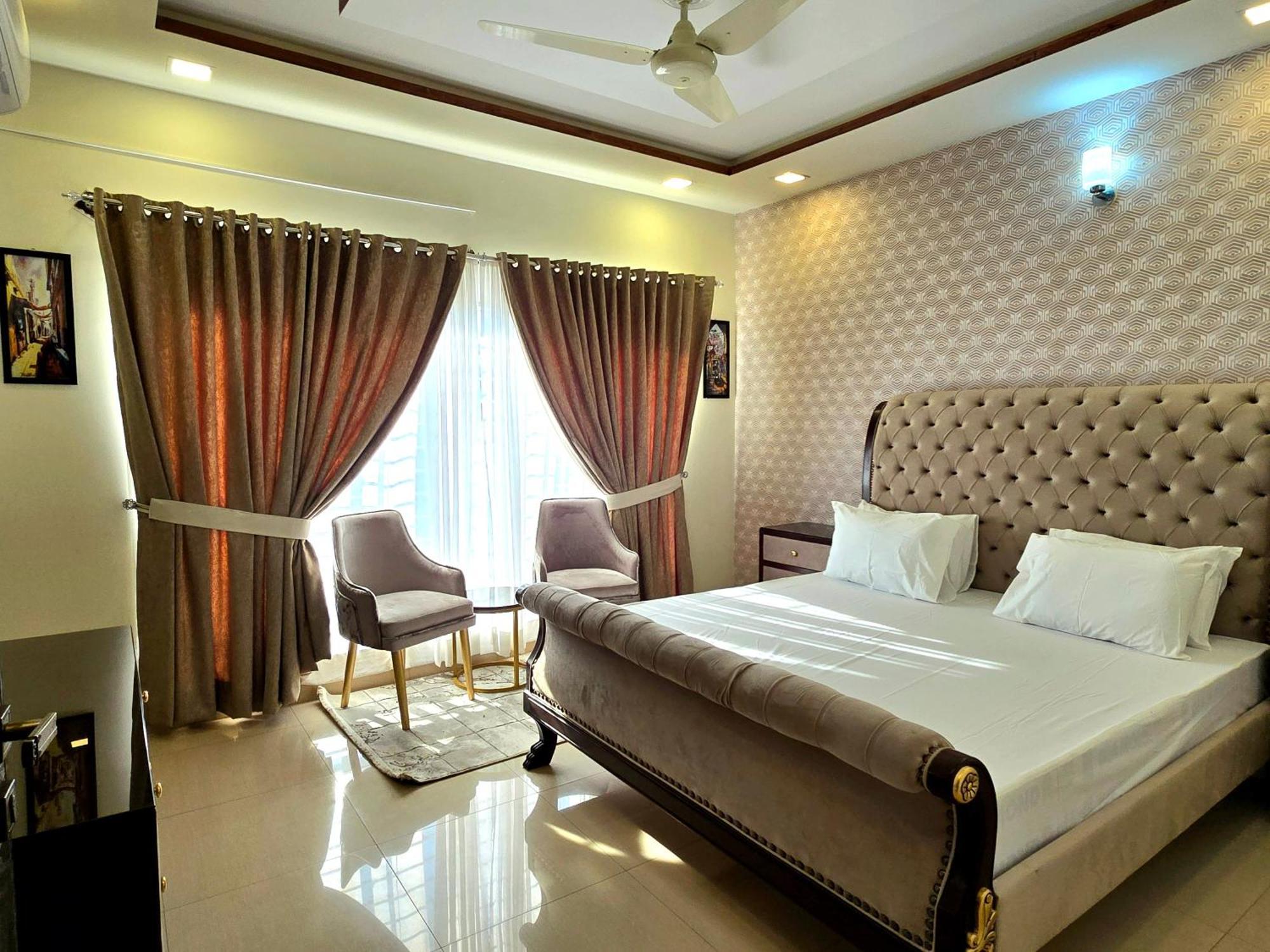 The Millenial Apartments & Suites Bahria Town Rawalpindi Oda fotoğraf
